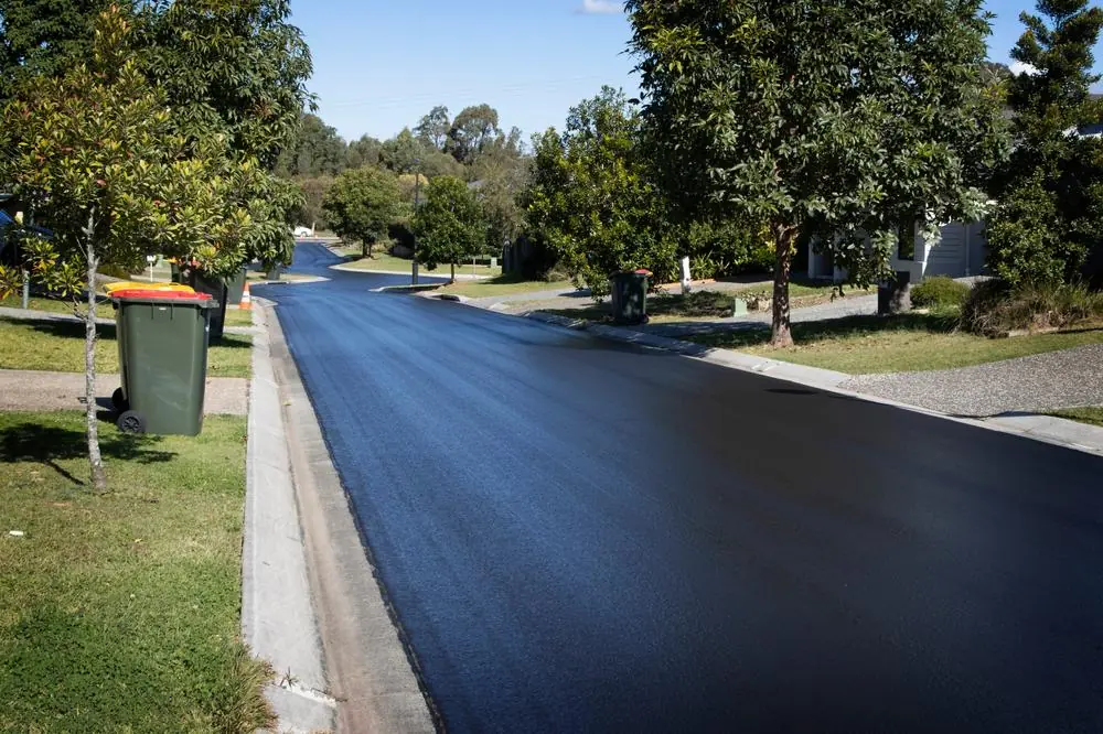 Smooth asphalt roadway through a residential neighborhood