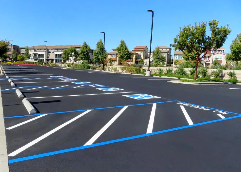 Freshly striped commercial parking lot with accessible parking spaces